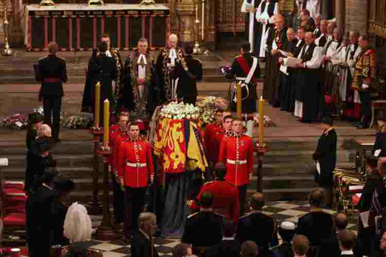 Soldiers stand around the coffin of Queen Elizabeth, the Queen Mother, in Westminster Abbey