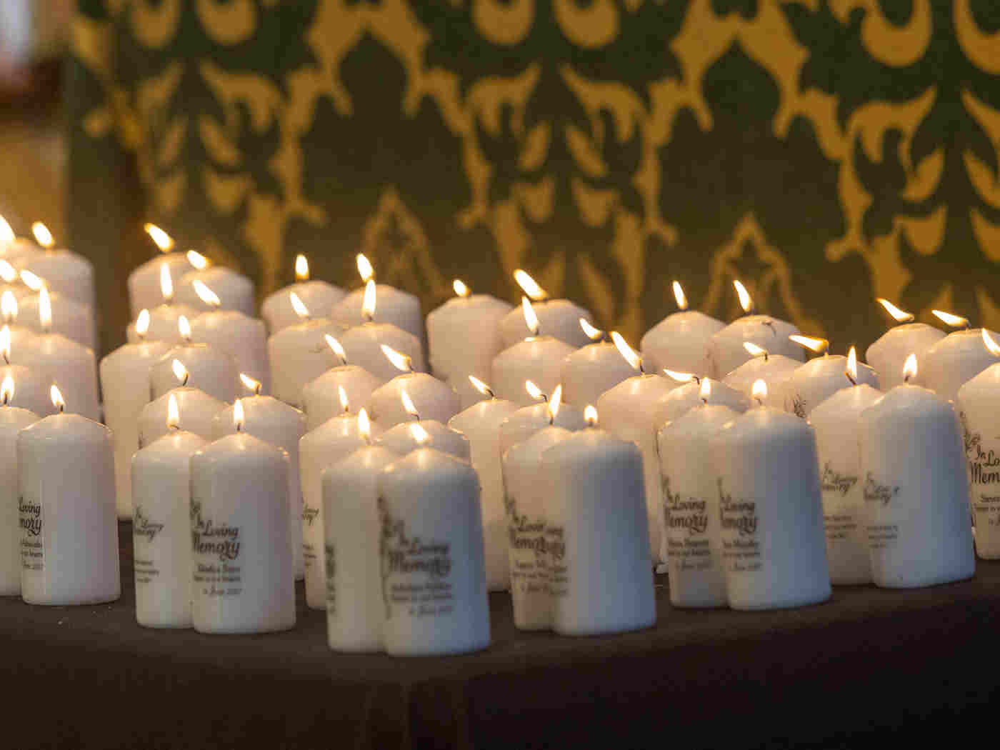 Candles are lit in memory of those who died