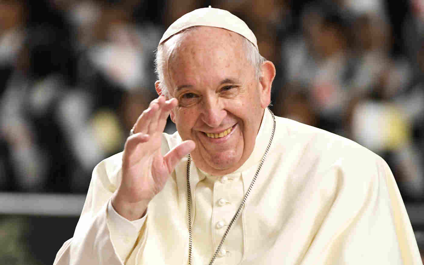 Pope Francis smiling and waving
