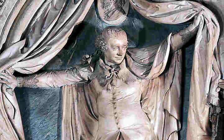 Photograph of memorial to actor David Garrick, dramantically opening a pair of curtains