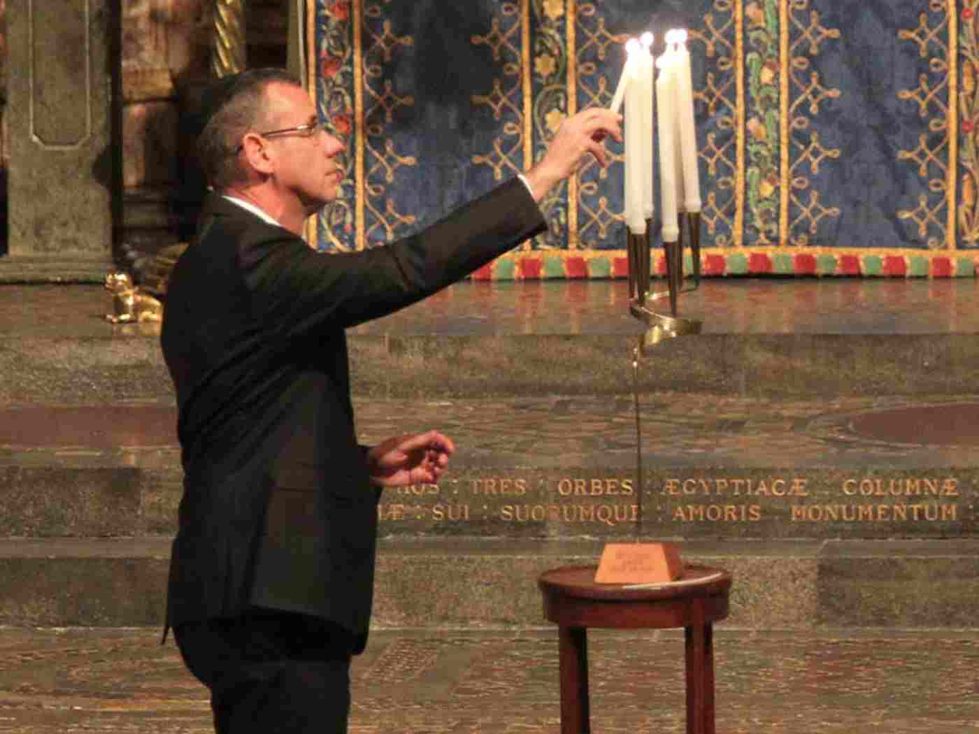 Mark Regev, Israeli Ambassador, lights a memorial candle