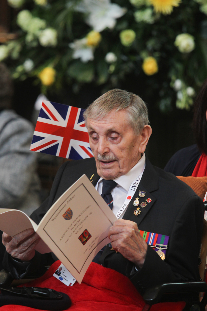 Veteran looks at the Order of Service