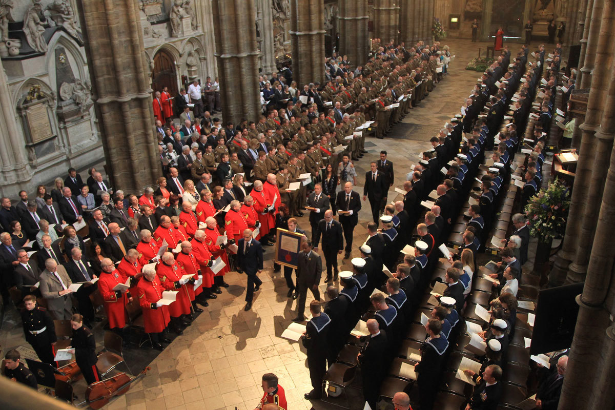 The Royal Charter Supplement of the Commonwealth War Graves Commission and the Civilian War Rolls are processed through the Abbey church