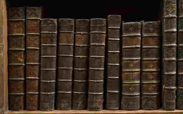 Brown leather-bound books in the Westminster Abbey Library