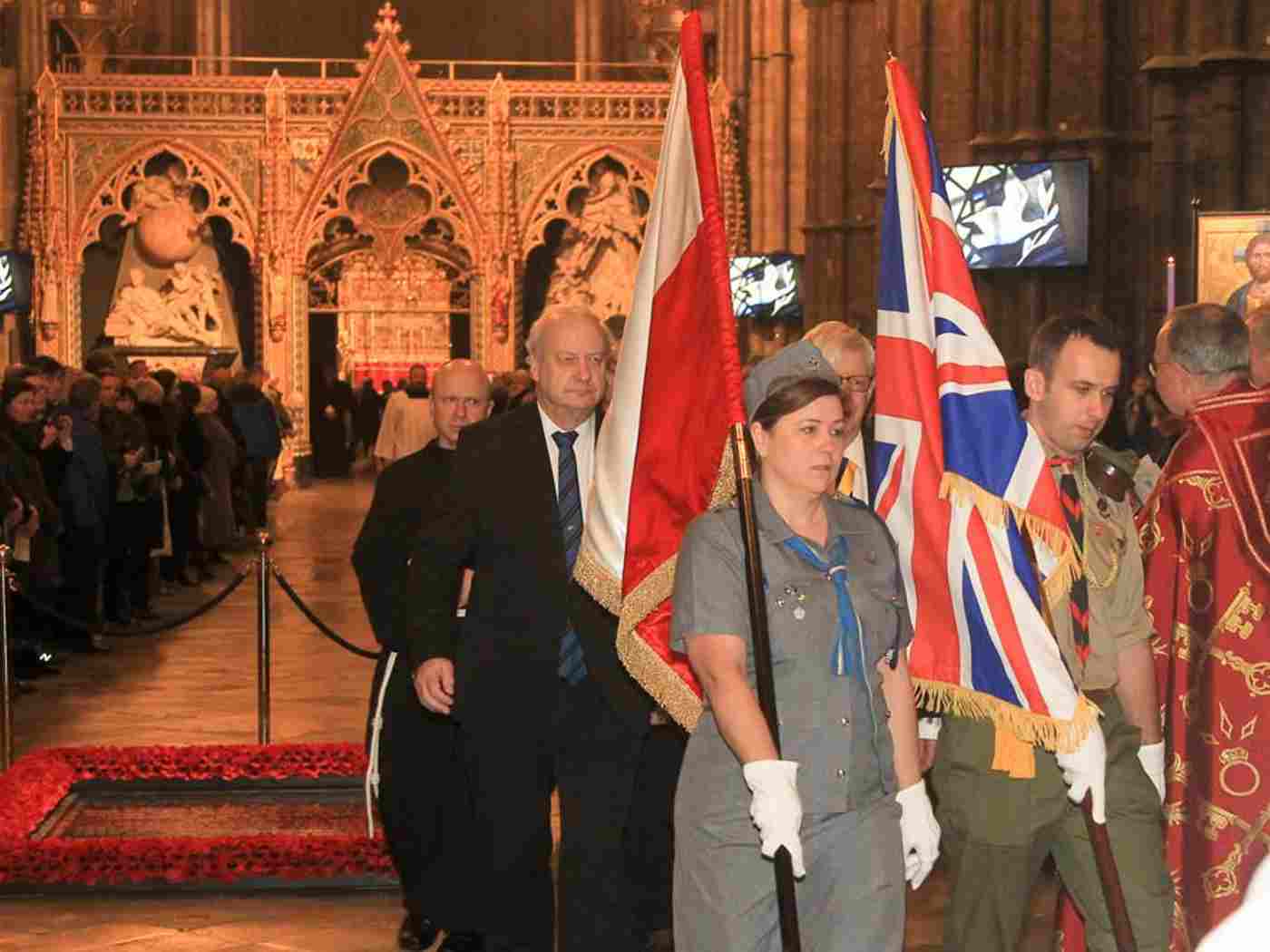 The flags of the United Kingdom and Poland are processed out